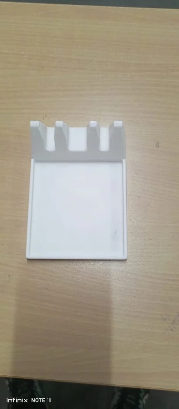 Original compact spoon-holder prototype with an integrated drip tray